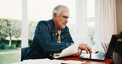 Buy stock photo Serious, old man and reading at house with laptop, research and finance report for mortgage loan. Senior person, typing or pc in home with documents, pension claim and financial information for audit
