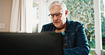 Serious, old man and reading at house with laptop, research and finance mistake for wrong account. Stress, senior person or pc in home for overdue bills, pension claim issue and retirement bankruptcy