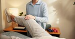 Physiotherapy, leg exam or hands in center for health, mobility test or aid in rehabilitation. People, patient or chiropractor with consultation, joint assessment or stretching in muscle recovery.