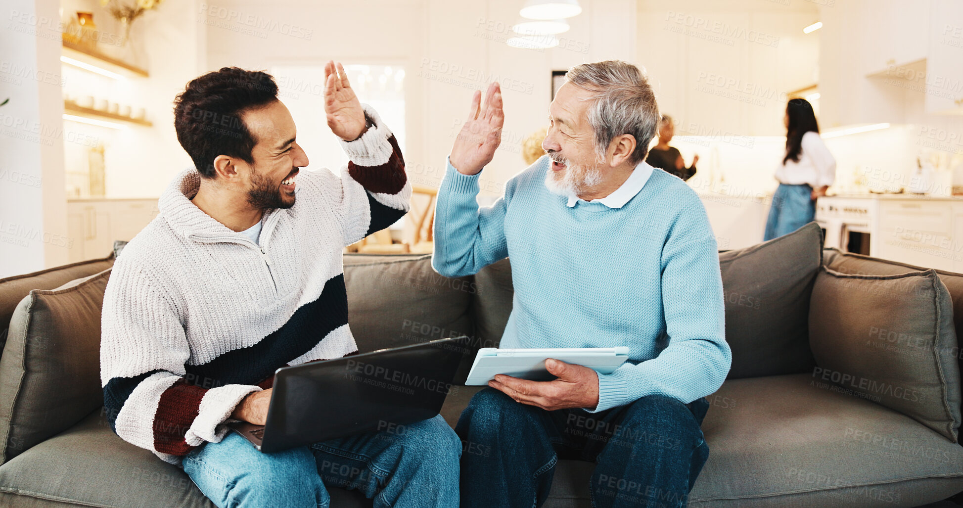 Buy stock photo High five, man and senior parent with technology in home living room for bonding, success or visit. Laptop, tablet or victory with adult son and elderly father on sofa in apartment for family sharing