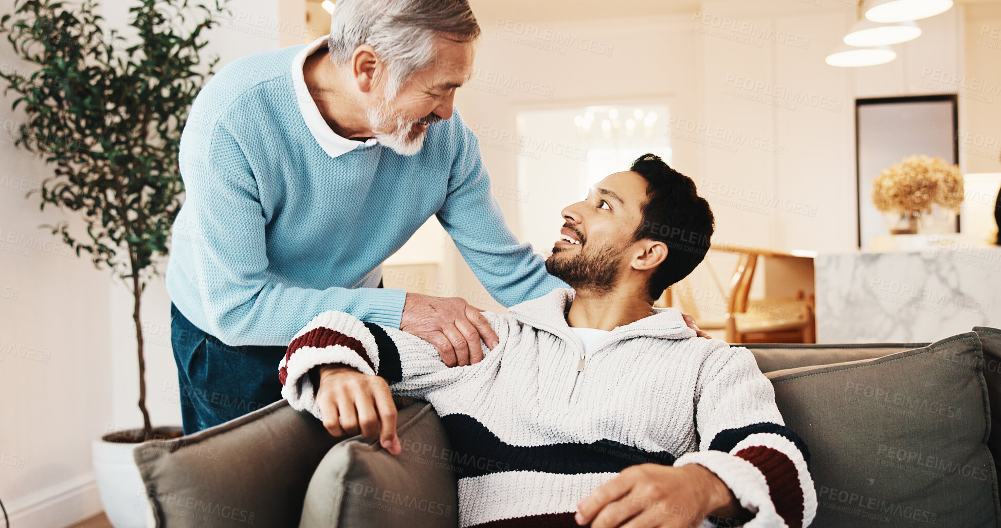 Buy stock photo Advice, old man and talking to adult son in home living room for bonding, support or visit. Conversation, love and smile of person speaking to senior parent on sofa in apartment for family connection