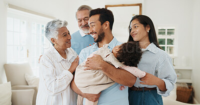 Buy stock photo Grandparents, visit and family with baby in home, smile and laughing with child on weekend and love. Senior parents, generations and happy people with girl, embrace and connection together in house