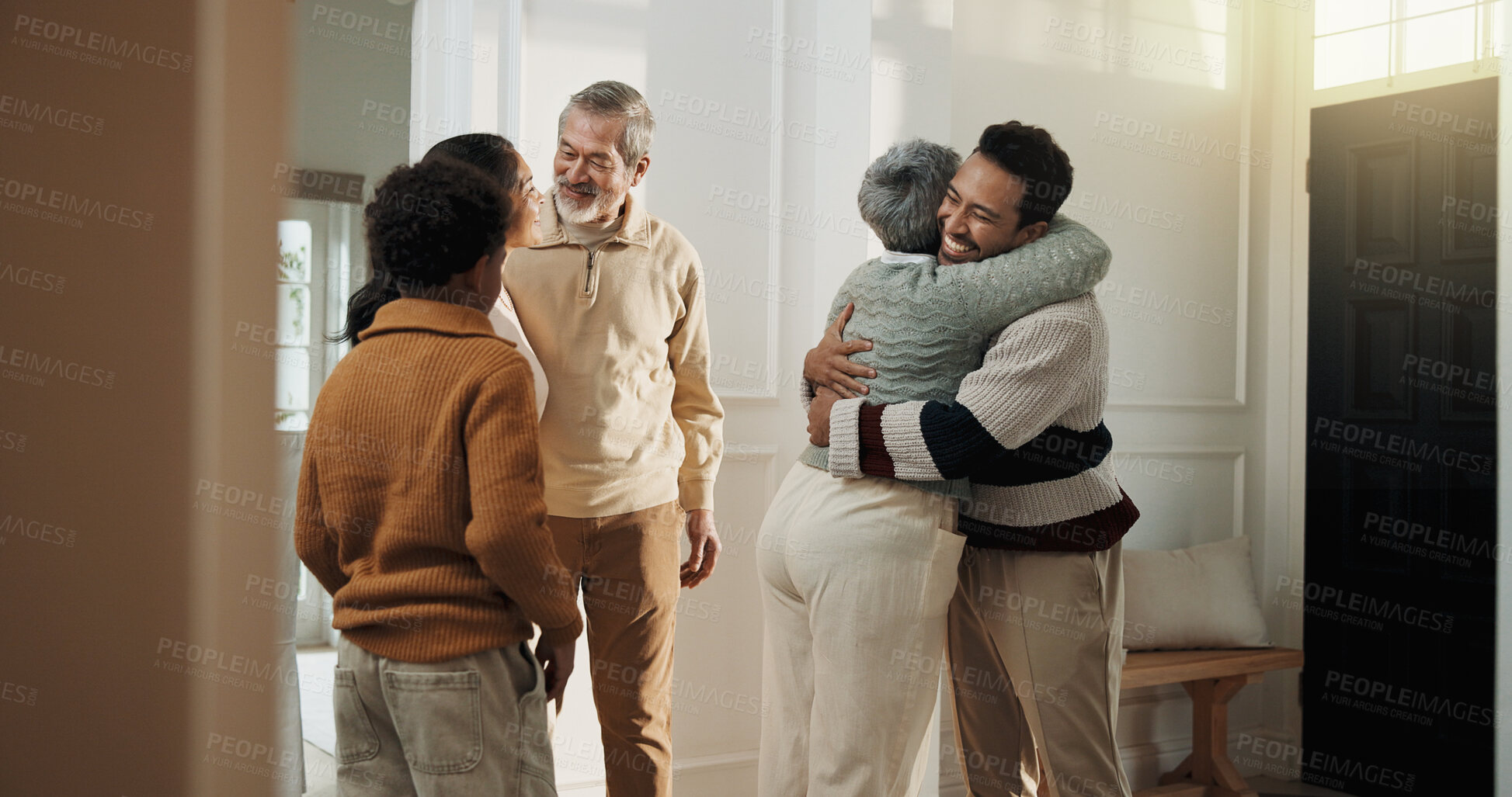 Buy stock photo Child, parents and senior people hug in home together for bonding, security or weekend visit. Break, connection and happy family embracing in apartment for affection, generations or retirement