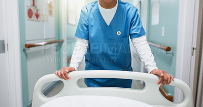 Buy stock photo Nurse, hands and push hospital bed in corridor for healthcare assistance, inpatient care and service. Medical worker, person and gurney in clinic hallway for emergency, wellness or journey to surgery