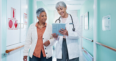 Buy stock photo Doctor, checkup and woman at hospital with tablet, test results and medical history for diagnosis. Mature people, walking or consulting in lobby with digital, patient discharge and healthcare records