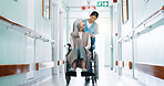 Push, wheelchair and nurse in clinic with old woman, medical assistance and happy for rehabilitation. Healthcare worker, smile and senior person with disability, healing or advice in hospital hallway