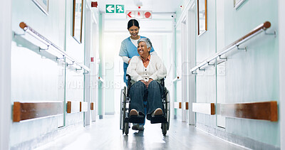 Buy stock photo Happy, nurse and woman in hospital with wheelchair, medical assistance and help for stroke recovery. Healthcare worker, smile and mature person with disability, healing and support in clinic hallway.