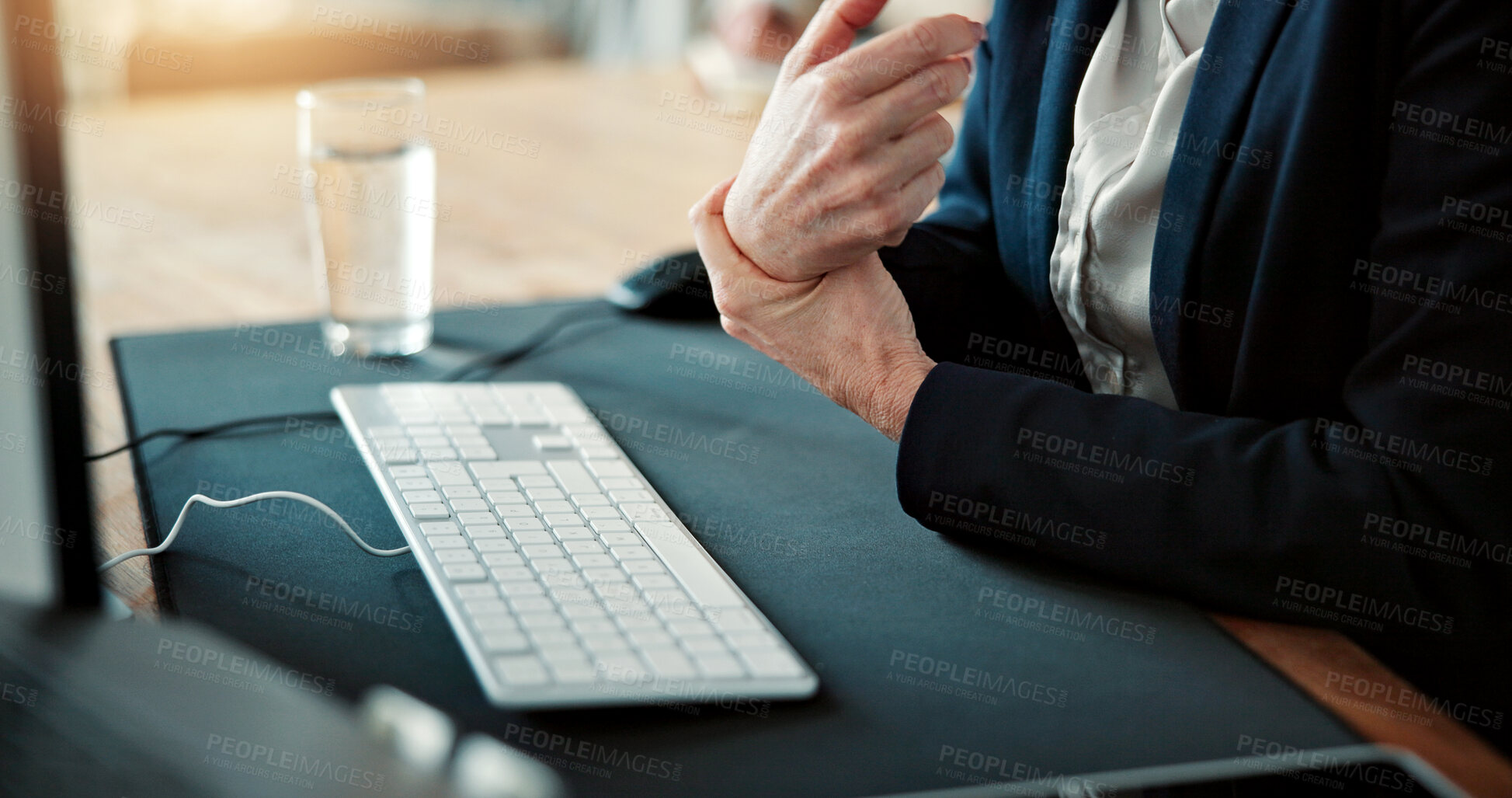 Buy stock photo Business, person or hands with wrist pain in office for muscle tension or carpal tunnel syndrome. Employee, keyboard or sore arm with joint inflammation for overworked strain or pressure in workplace