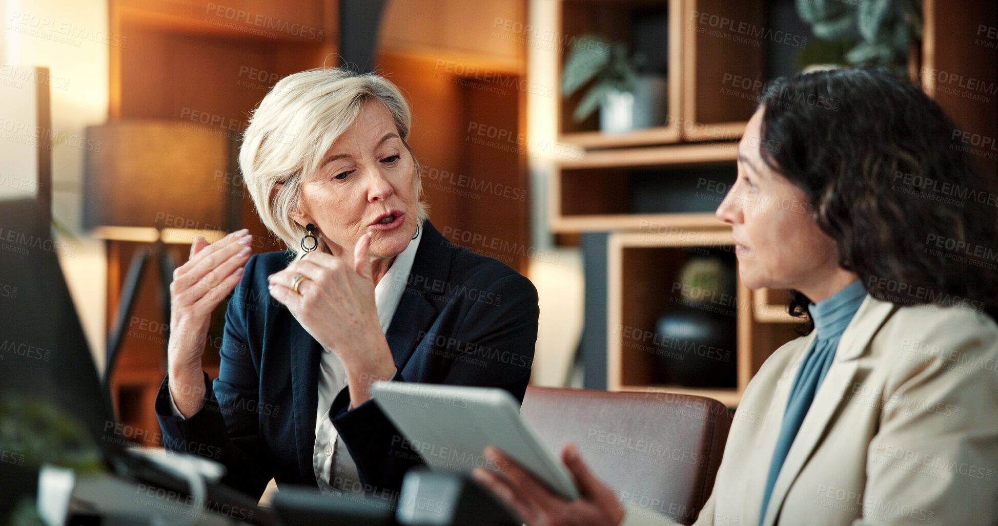 Buy stock photo Finance, discussion or women in office with tablet, cost plan or manager advice on funding pitch. Brief, digital or wealth advisor with tech, budget report or director review of investment proposal.