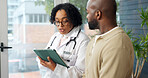 Doctor, tablet and discussion in office with patient, medical survey or online research for symptoms. Healthcare worker, tech and talk in consultation with person, wellness evaluation and advice.