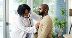 Doctor, patient and listen to heartbeat with stethoscope, cardiovascular assessment and medical help. Cardiologist, woman and hearing breathing of man with healthcare tools, exam or checkup in clinic