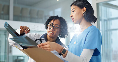 Buy stock photo Doctor, nurse and review xray in clinic, advice and feedback for medical treatment with specialist. Woman, surgeon and radiology scan for healthcare, guidance or help for diagnosis at hospital