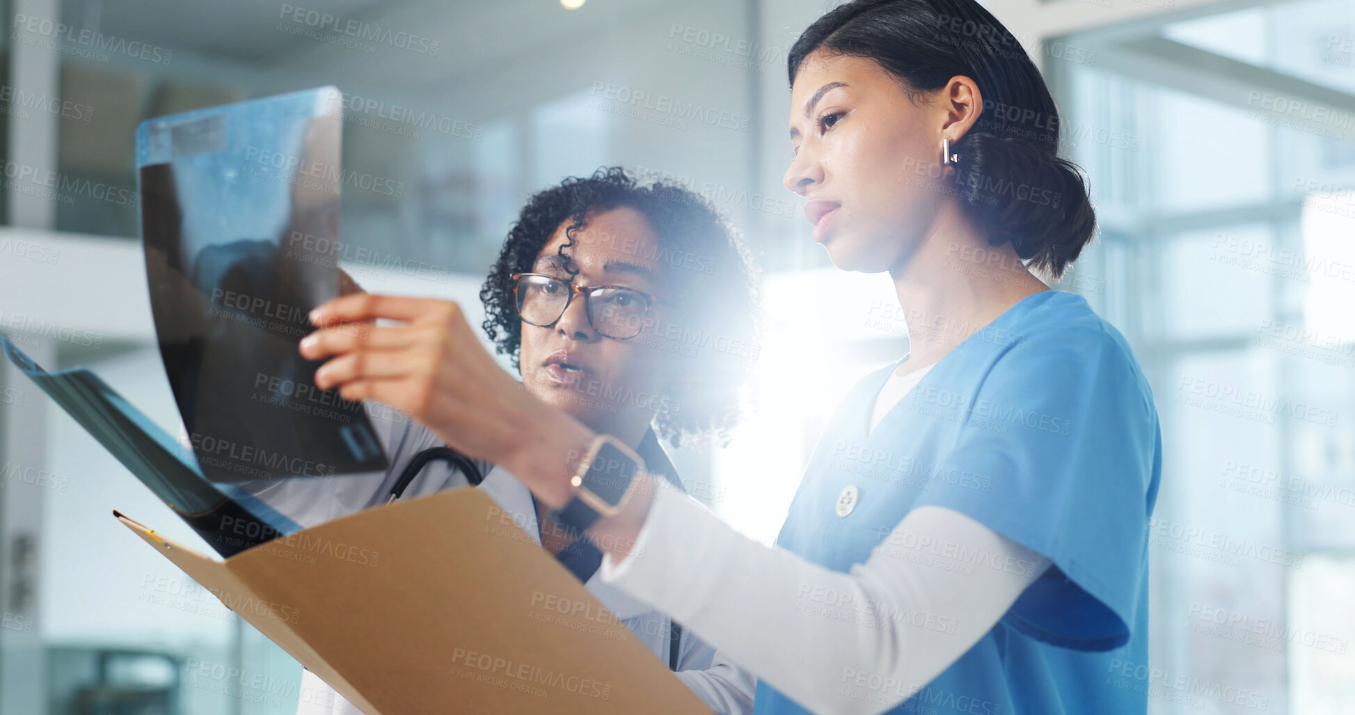 Buy stock photo Doctor, nurse and review xray for healthcare, advice or feedback for treatment with specialist at clinic. Woman, surgeon and radiology scan for medical care, guidance or help for diagnosis flare