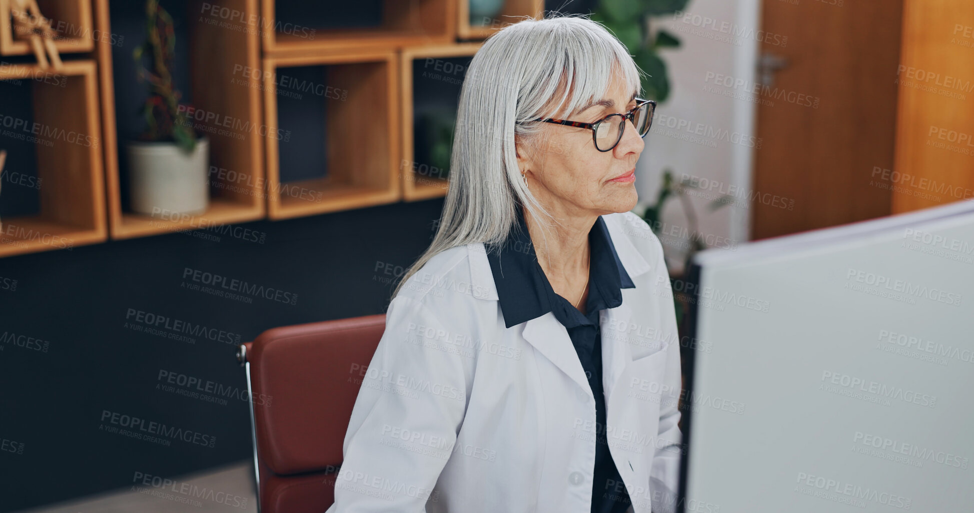 Buy stock photo Healthcare, doctor and woman with computer in office, research or reading treatment plan on website. Hospital, medical professional and mature person with technology, online and checking diagnosis