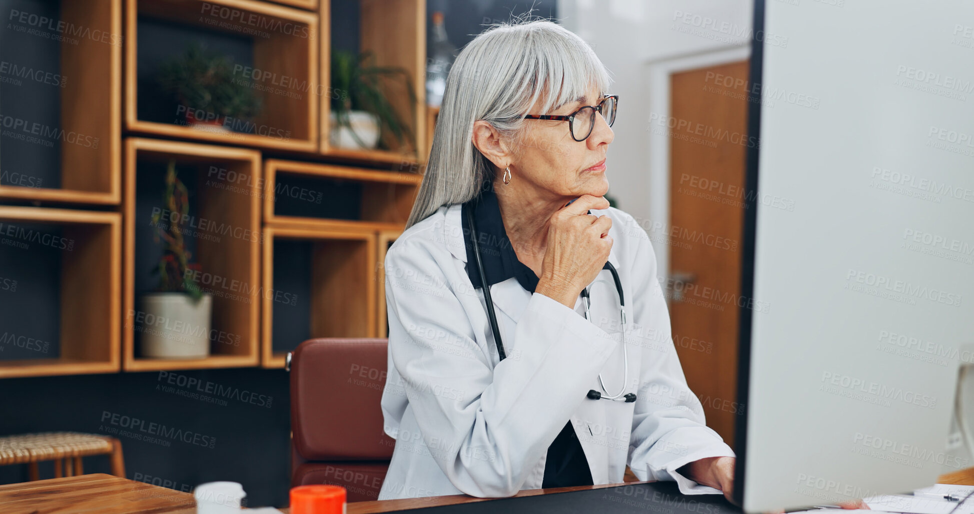 Buy stock photo Doctor, thinking and woman with computer in hospital, research or reading treatment plan on website. Medical professional, reflection and mature person with technology, online and diagnosis in office