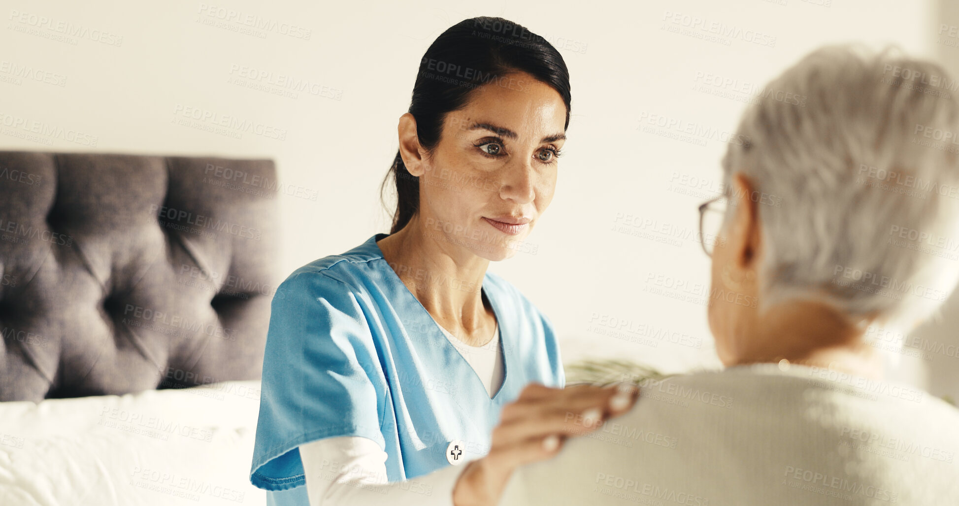 Buy stock photo Conversation, support and nurse with senior woman in bedroom at house for treatment planning. Discussion, comfort and caregiver with elderly patient for medical service or checkup in nursing home.