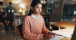 Computer, typing and planning with business woman in office for night, revenue report and online review. Portfolio research, overtime and investor project with employee in agency for asset management