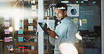 Strategy, business and man on tablet in glass office for data analysis, financial growth or research. Night, tech and person with sticky notes, charts and bokeh for budget report, review and planning