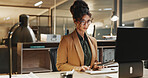 Typing, research and businesswoman with laptop in office, budget review and financial plan at night. Accountant, working late and person with tech, serious and checking expenses on web in business