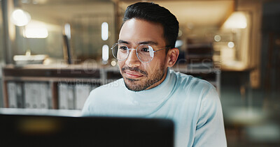 Buy stock photo Night, man or smile with computer in office for breaking news, story editing or print deadline. Overtime, glasses or editor with tech at media agency for proofreading article, grammar check or review