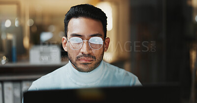 Buy stock photo Employee, glasses and man with laptop in office, budget review or financial plan with info at night. Accountant, working late and person with tech, serious and checking expenses on web in business