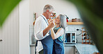 Dance, cooking and smile with old couple in kitchen for bonding, romantic gesture and meal prep. Connection, support and food with senior man and woman in home for retirement, movement and recipe