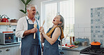 Karaoke, cooking and love with old couple in kitchen for bonding, laughing and meal prep. Connection, support and food with senior man and woman and spoon in home for retirement, singing and music