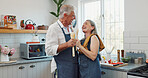 Karaoke, cooking and laugh with old couple in kitchen for bonding, love and meal prep. Connection, support and food with senior man and woman and spoon in home for retirement, singing and music
