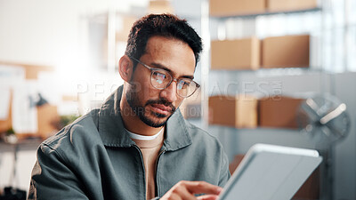 Buy stock photo Reading, man and tablet in small business for logistics, fleet tracking system or online invoice. Glasses, person or tech in supply chain for shipment status, digital receipt or bill of lading review
