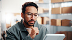 Glasses, man and logistics worker with tablet in office with research, inventory or online order. Thinking, cargo service and supply chain manager with digital technology for delivery information. 