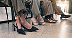 Feet, row and people in waiting room for interview, application and patience for recruitment. Legs, shoes and candidates in office for hiring, human resources and selection process for job vacancy