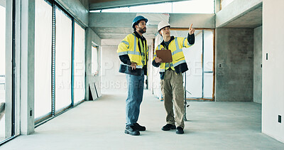 Buy stock photo Engineer, inspection and men with clipboard in building, pointing or planning for renovation project. Civil engineering, people and quality assurance with checklist, teamwork and property development