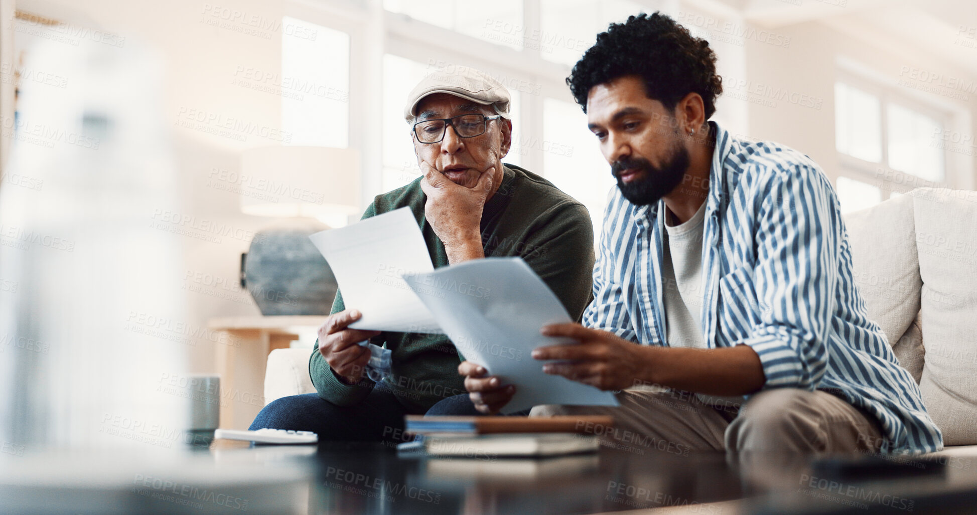 Buy stock photo Old man, family and document at house for finance, review budget and report for household bills. Senior father, adult son or reading in home with letter, utility expenses and bank statement for audit