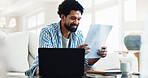 Smile, man and reading at house with document, finance report and budget for household bills. Happy, person and laptop in lounge with paperwork, financial invoice and bank statement for rebate payout