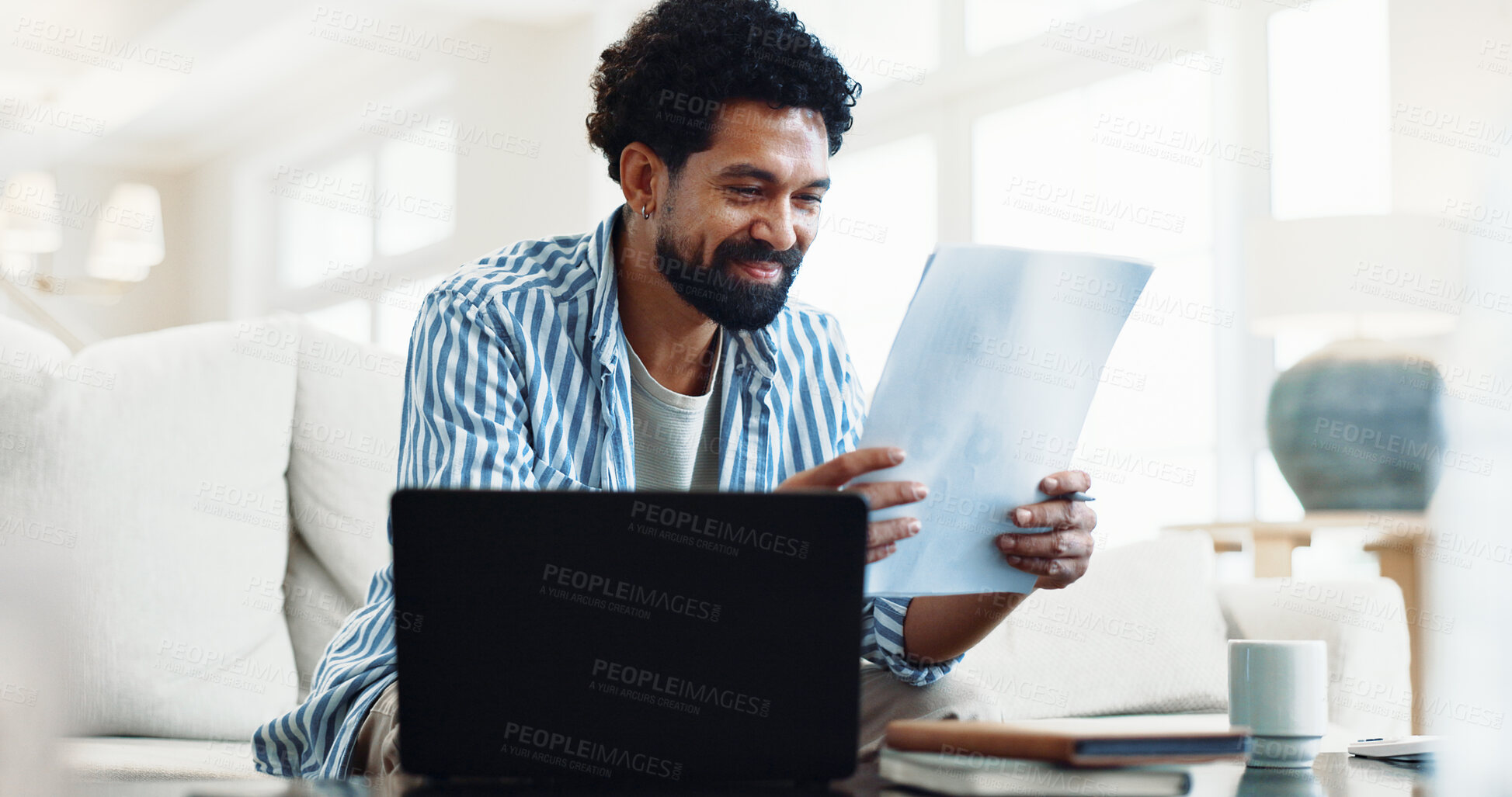 Buy stock photo Smile, man and reading at house with document, finance report and budget for household bills. Happy, person and laptop in lounge with paperwork, financial invoice and bank statement for rebate payout