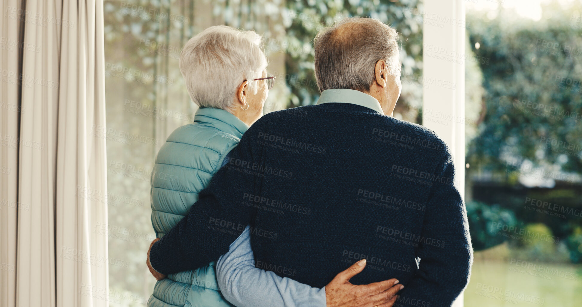 Buy stock photo Love, thinking and old couple at window with hug, relationship reflection and memory in retirement. Back, connection and senior people with embrace, romantic flashback or peaceful perspective in home