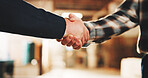 Carpenter, people or meeting with handshake in warehouse for building partnership or agreement. Carpentry, employees or colleagues shaking hands with deal together in workshop for service delivery