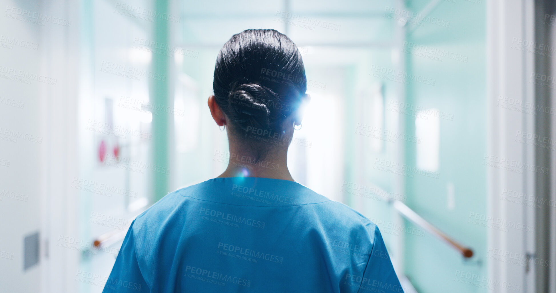 Buy stock photo Back, nurse and walking in clinic for healthcare, punctual female person and wellness service. Woman, hospital hallway and arrival of professional clinician, medical duty and shift at corridor
