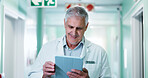 Doctor, happy man and tablet for medical review, schedule report or reading test results in hallway. Tech, mature person or healthcare worker in clinic for electronic health records, history or smile