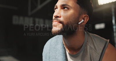Buy stock photo Thinking, earphones and fitness with man in gym for workout rest, reflection and sports athlete. Exercise, music streaming and training with person in club for wellness, body builder and vision