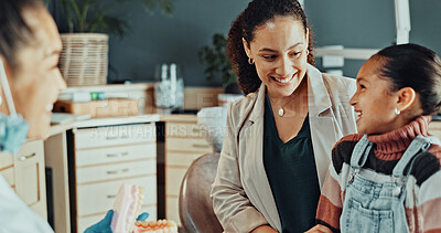 Buy stock photo Mom, child and consultation with dentist in clinic for oral healthcare, treatment or hygiene. Mother, daughter or kid with smile or orthodontist for dental appointment, cleaning or gum care together