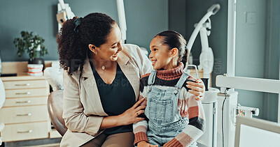 Buy stock photo Mom, child and support in clinic for dental appointment, teeth cleaning or oral treatment together. Mother, kid or daughter with smile for dentist visit, medical checkup or comfort in dentistry