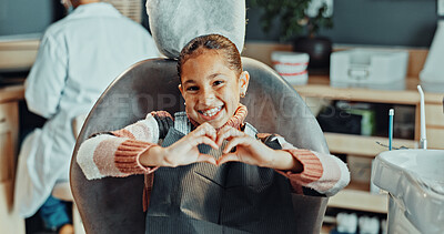 Buy stock photo Portrait, girl and heart hands with dentist in clinic for oral hygiene, treatment or satisfaction. Child, kid or patient with smile, like emoji or love for dental appointment, gum care or healthcare