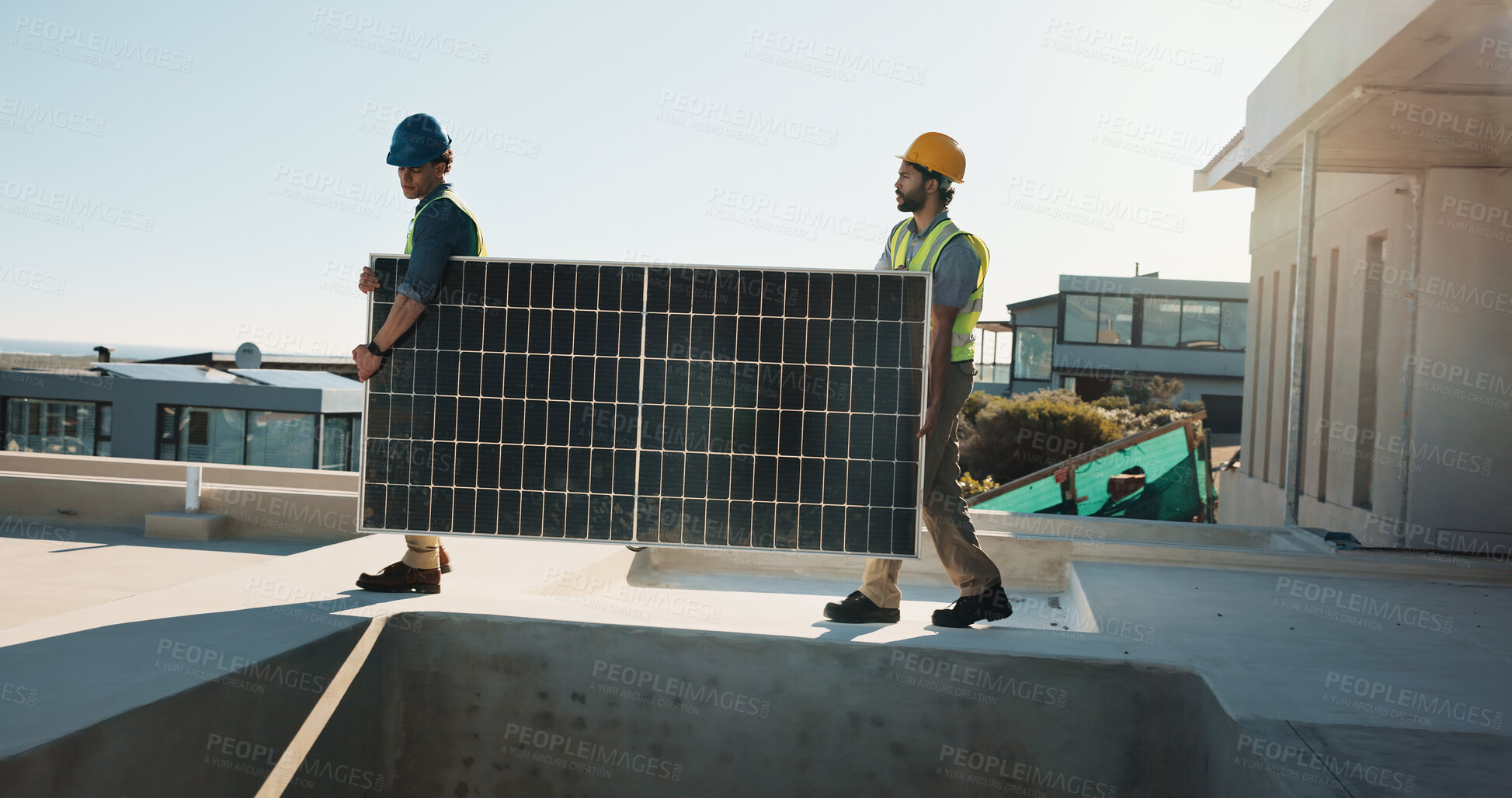 Buy stock photo Engineer, teamwork and outdoor with solar panel for maintenance, upgrade infrastructure and project. Men, carry and photovoltaic grid at site with system, clean power or energy source at eco building