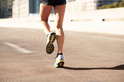 Buy stock photo Fitness, active and legs in city with running, cardio and stamina exercise in physical activity. Training, space and female person outdoor with jog, sports hobby and athletic workout in town.