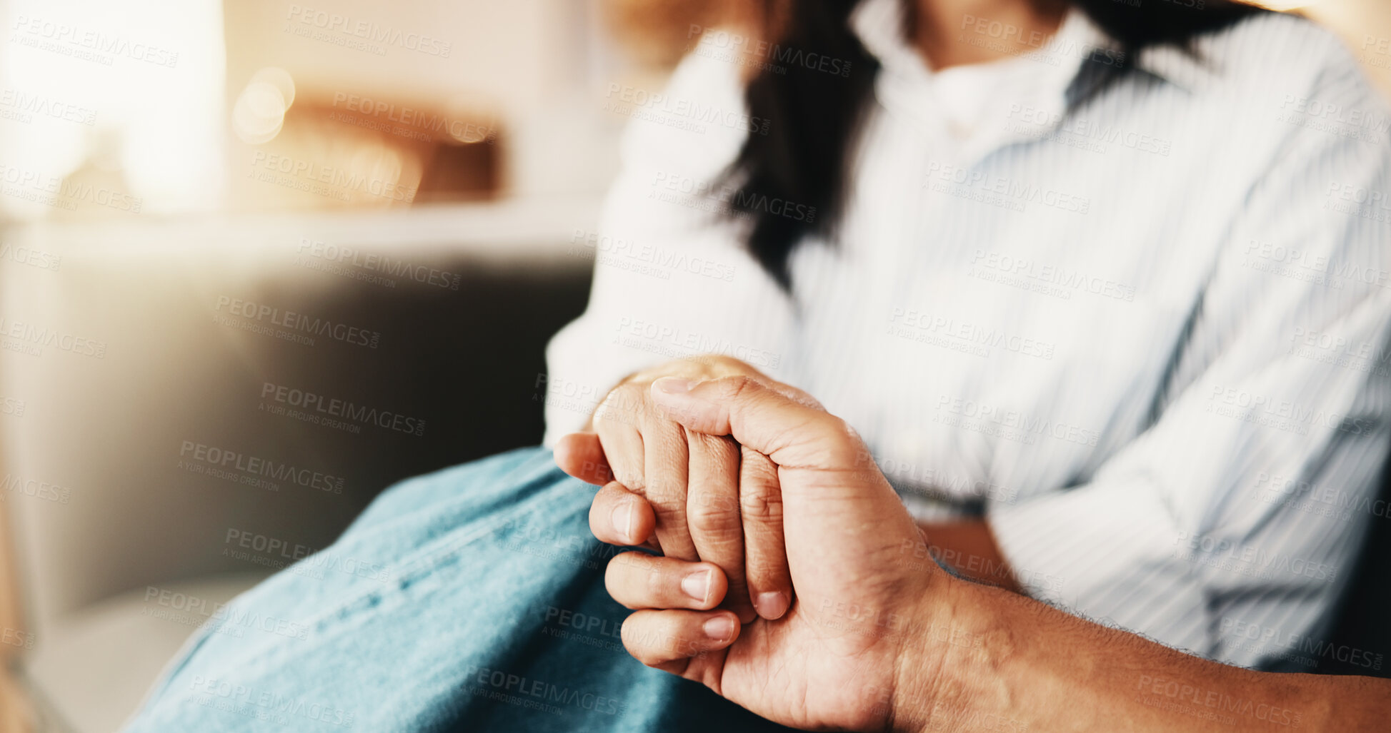 Buy stock photo Couple, holding hands and bonding with partner in home, trust and relationship commitment in lounge. Marriage, loyalty and support for spouse, people and solidarity for love and partnership in house