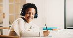 Portrait, child and headphones in house with homework, smile or listen to music for cognitive growth. Happy, boy and writing in home with school task, education and audio tech for streaming playlist.