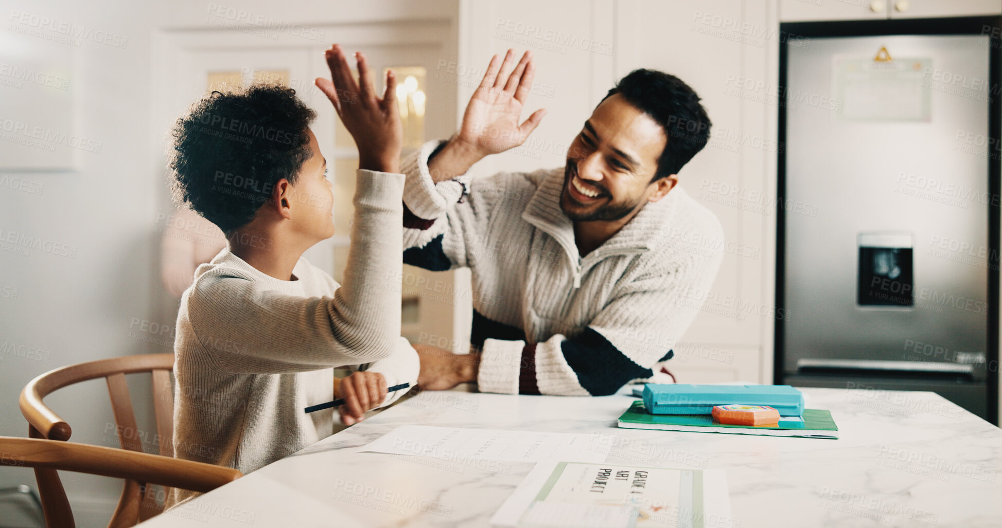 Buy stock photo Father, child and high five in house with homework, learning success and cognitive development goals. Happy, man and son with celebration for understanding task, education and achievement in home.