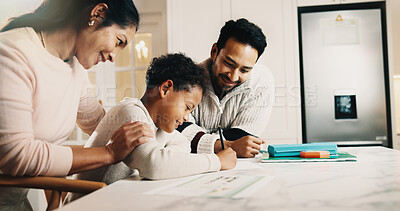 Buy stock photo Parents, child and writing in house with homework, assistance and support for knowledge development. Happy people, mom and dad at kitchen counter with son, education and help for school assignment.