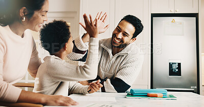 Buy stock photo Parents, child and high five in house with homework, learning success or cognitive development goals. Happy people, mother and father in home with son, education or celebration for understanding task